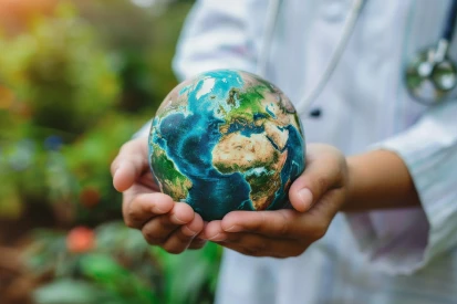 Medical professional holding world in hands